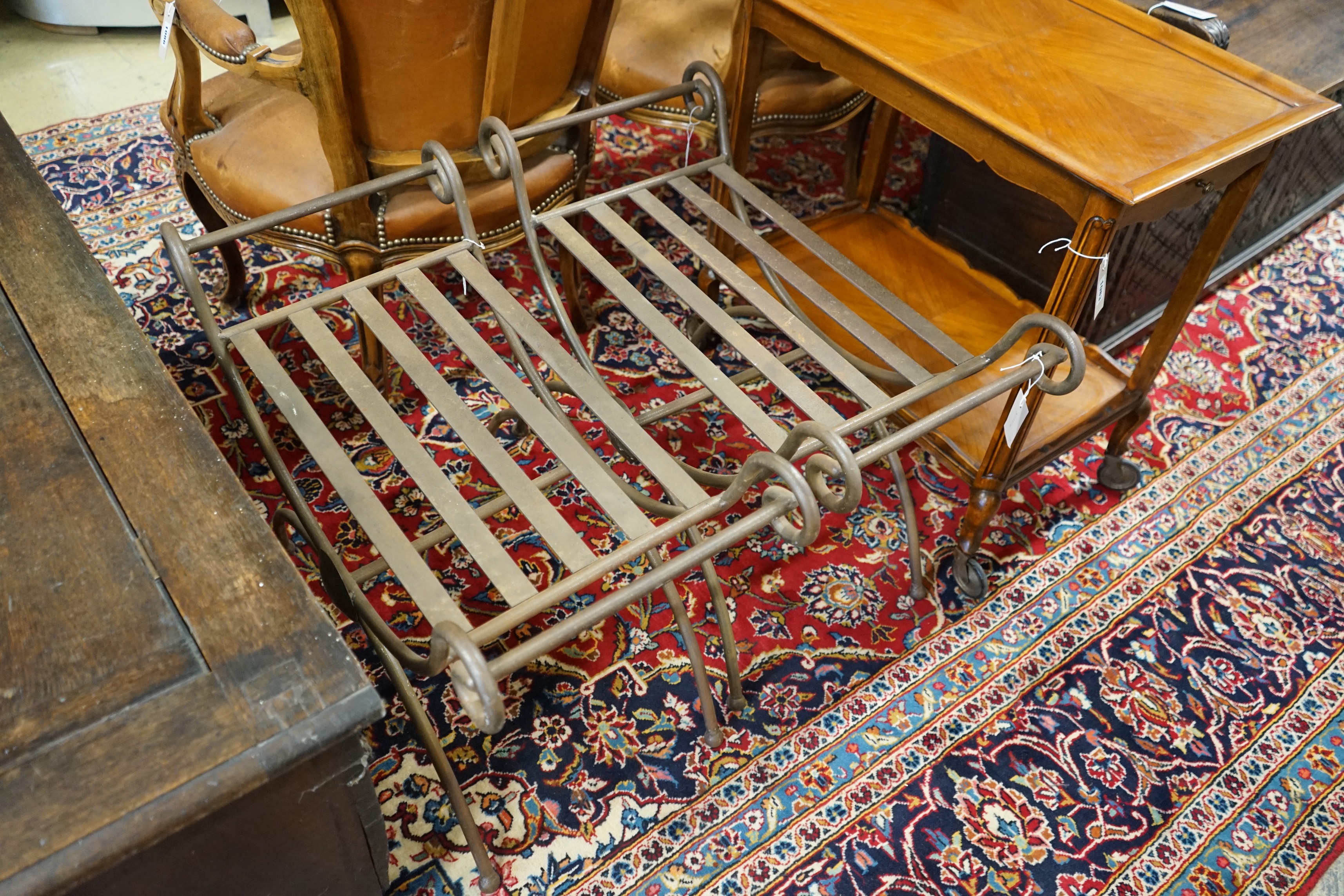 A pair of wrought iron X frame stools, length 74cm, depth 35cm, height 56cm